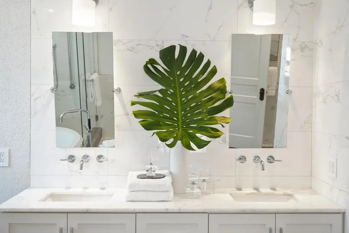 Remodeled bathroom with marble double vanity and modern fixtures in San Francisco