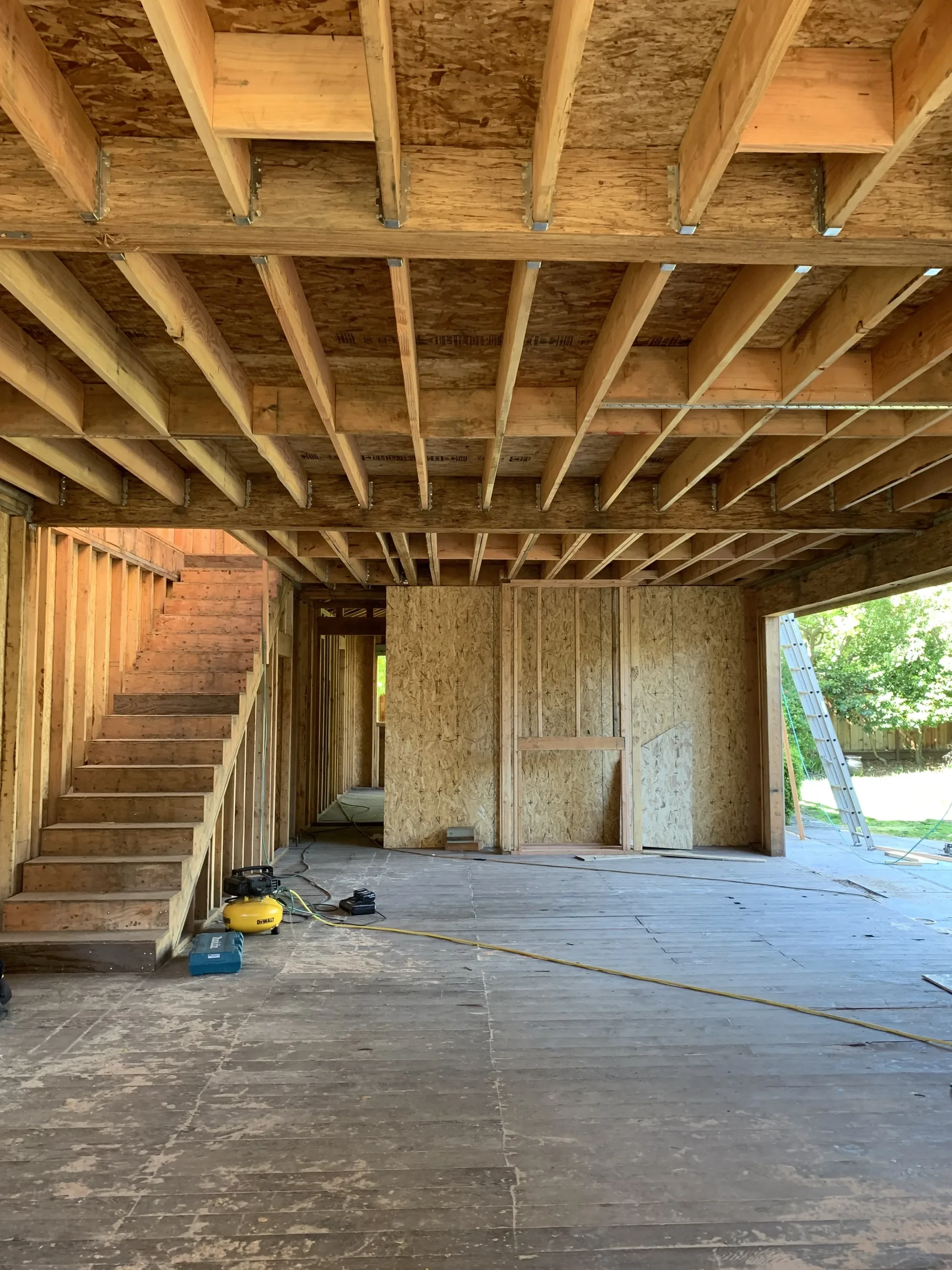 Interior framing with a new stair opening and plywood exterior panels