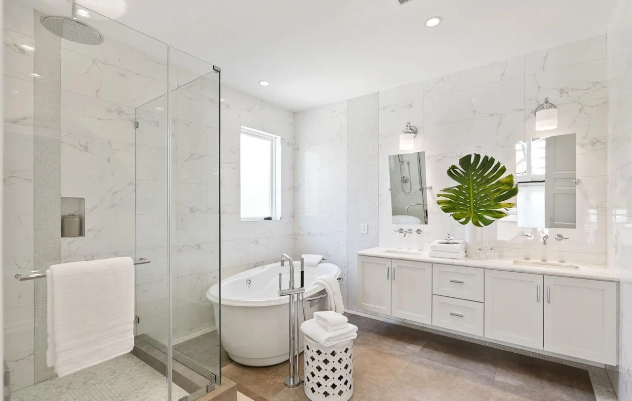 Remodeled bathroom with marble double vanity and modern fixtures in San Francisco