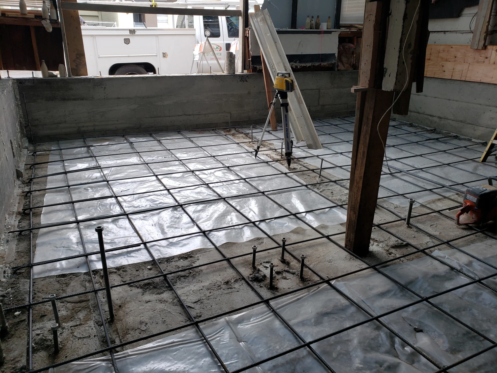 Foundation excavation with a rebar grid tied and ready for a concrete pour