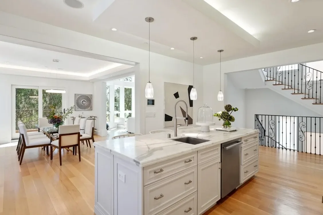 Open kitchen with large island created by a load-bearing wall removal